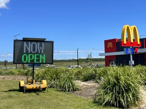 Five colour VMS sign hire — McDonald's NOW OPEN daytime